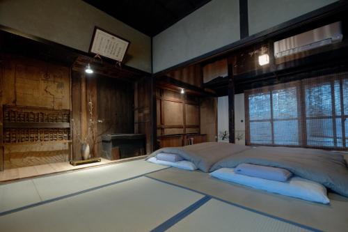 a bedroom with a large bed with two pillows at Asago - House - Vacation STAY 43959v in Takeda