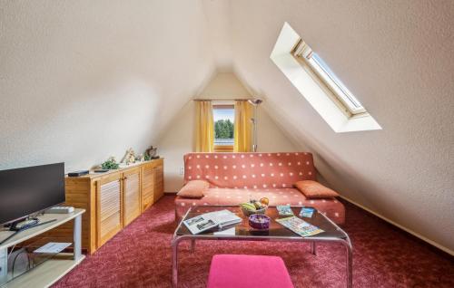 a living room with a couch and a table at Ferienwohnung Neuhermsdorf in Neuhermsdorf
