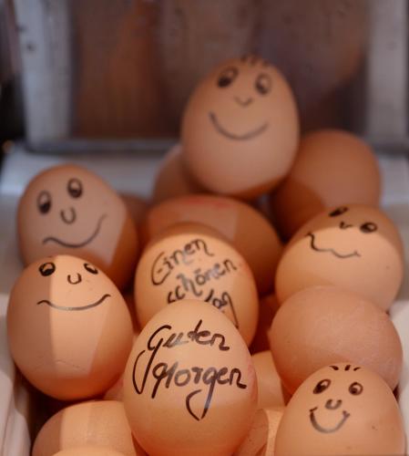 a pile of eggs with faces drawn on them at HansenS Haus am Meer in Bad Zwischenahn