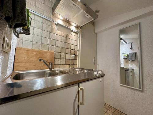 a kitchen with a sink and a counter top at Baumeisterhaus Apartment in Bad Hersfeld