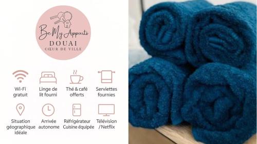 a close up of a bunch of blue towels at BE MY APPARTS, Studio de charme "LE CARILLON", DOUAI, Coeur de ville in Douai