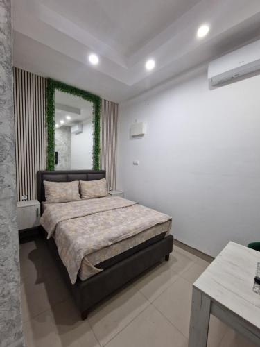 a bedroom with a large bed in a room at Apartman Kruna in Priboj