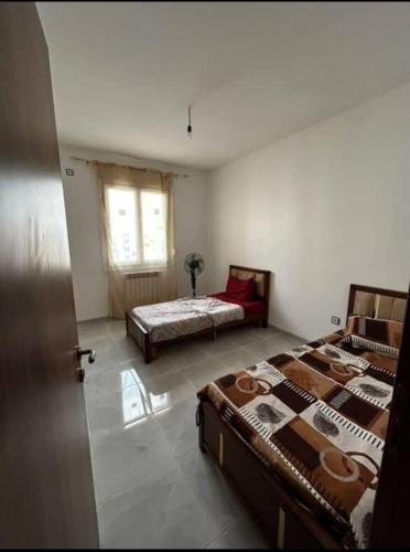 Ένα ή περισσότερα κρεβάτια σε δωμάτιο στο Bel appartement