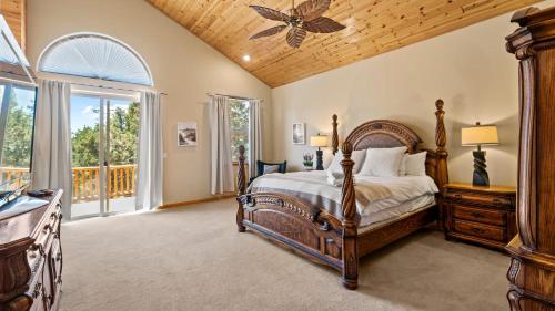 a bedroom with a bed and a wooden ceiling at Linaker Lodge by AvantStay Gorgeous Cabin in Big Bear w Views in Big Bear Lake