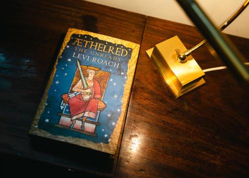 a book sitting on top of a table at Aethelred Annexe - New Build with Full Amenities in Winchester