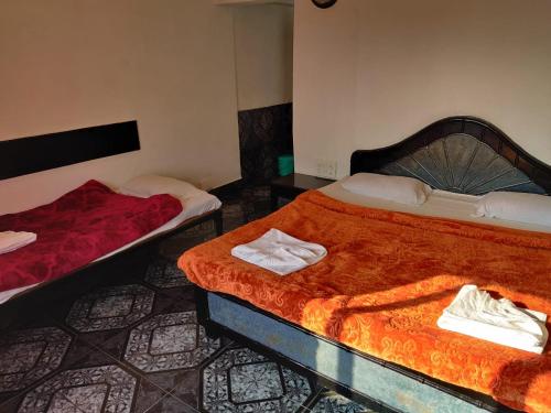 Ένα ή περισσότερα κρεβάτια σε δωμάτιο στο Hotel Rahil International