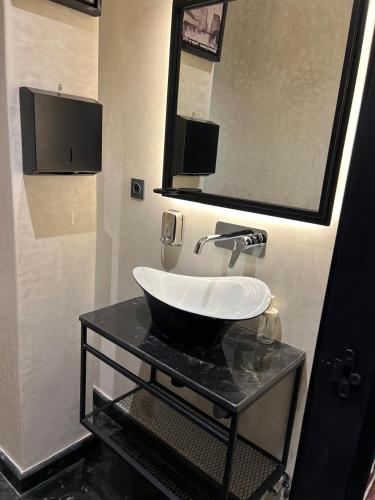 a bathroom with a sink and a mirror at ABMGreen in Tangier