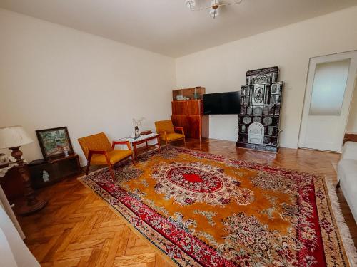 a living room with a rug on the floor at Casa RusTic in Turda