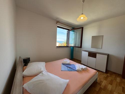 En eller flere senge i et værelse på Apartment Marina