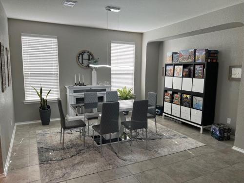 a dining room with a table and chairs at Relax with Spacious Modern Simplicity in Boerne