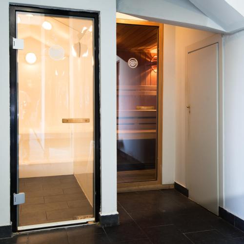 a glass door leading into a room with a hallway at Campus Cerdanya in Puigcerdà