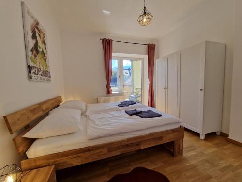 a bedroom with a large bed in a room at Mariazell Appartement Kugeltreff in Mariazell