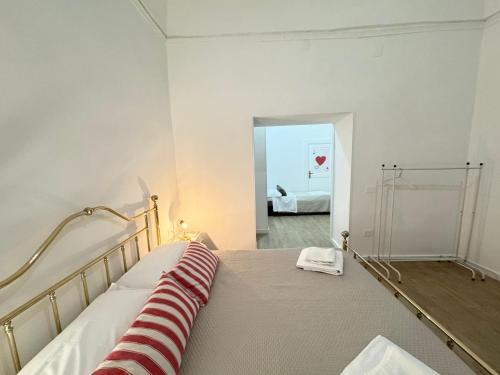 a bedroom with a bed with a red and white blanket at META CC PALACE with pool in Meta