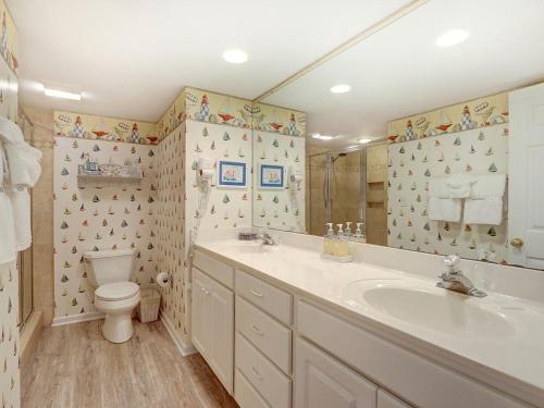 a bathroom with a sink and a toilet at Stay-A-While in Tybee Island