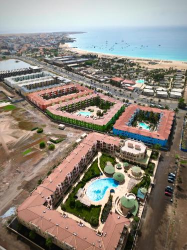 an aerial view of a resort next to the ocean at Ocean & Pool - 2 bedroom Apartment in Santa Maria