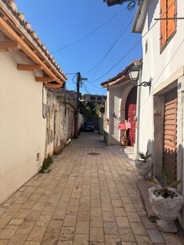 an alley in an old town with buildings at The Journey Inn in Shkodër