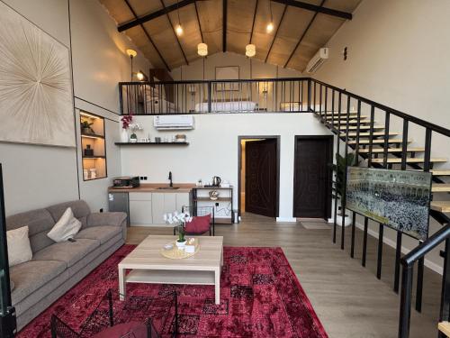 a living room with a couch and a table at غصن الهدا in Al Hada