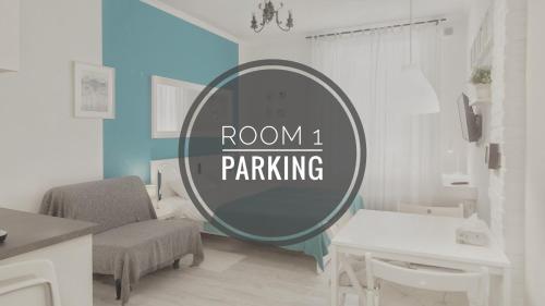 a room with a mirror and a chair and a table at Apartmaji Diversorio in Izola