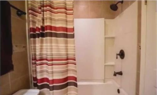a bathroom with a shower with a shower curtain at 4182 Thistle cir in Virginia Beach