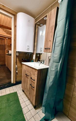 a kitchen being remodeled with a sink and a mirror at Chata Chochlika in Rybczyzna