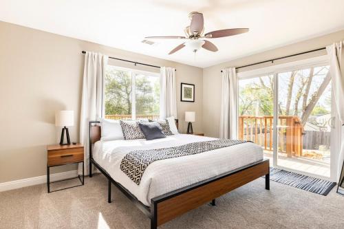 a bedroom with a bed and a ceiling fan at Wine Country Private Backyard and Bocci Ball in Atascadero