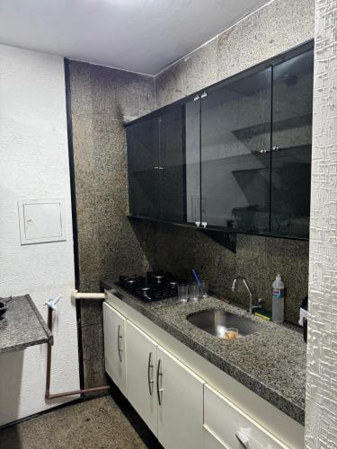 a kitchen with a sink and a counter top at Beira-Mar Flat Venetto - Premium in Fortaleza