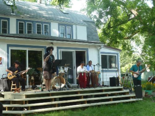 a band playing on the porch of a house at Morning Glory B&B Woodstock NY in Woodstock