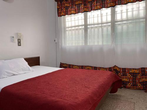 Ένα ή περισσότερα κρεβάτια σε δωμάτιο στο Villa Rene
