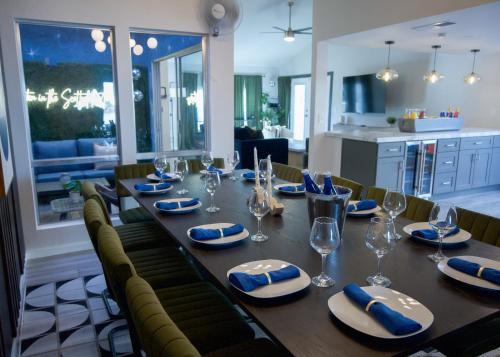 a long table with chairs and wine glasses on it at LUX NEW! Heated Pool Option, 2Kings, Spa, Old Town, WestWorld, Fashion Square in Scottsdale