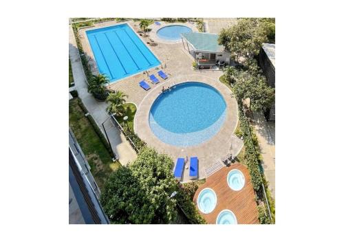 Apto Santa Marta 5 minutes from the beach, pozos colorados, sazue, irotama, tayrona, playa, bello horizonte, mar内部或周边的泳池