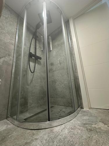 a shower with a glass door in a bathroom at Estudio de Lujo in Torrevieja