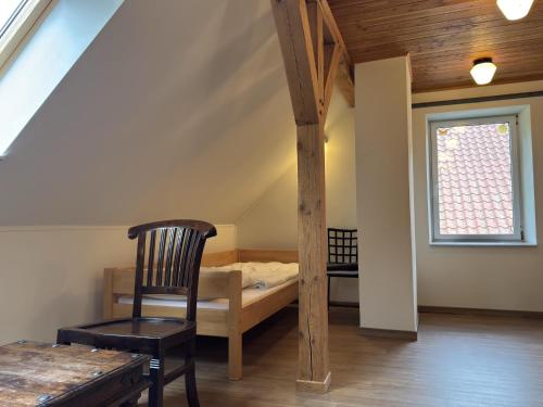 a room with a bed and a chair and a window at Ferienhaus in Neu Poserin for 5 Personen in Neu Poserin