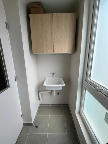 a bathroom with a sink and a window at Departamento Temuco in Temuco