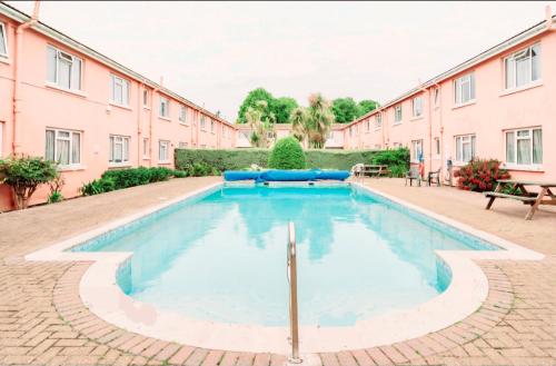 a swimming pool in the middle of a building at 45 New Esplanade Court in Paignton