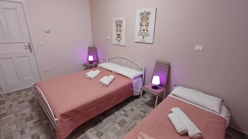 Ένα ή περισσότερα κρεβάτια σε δωμάτιο στο Angela apartments 01