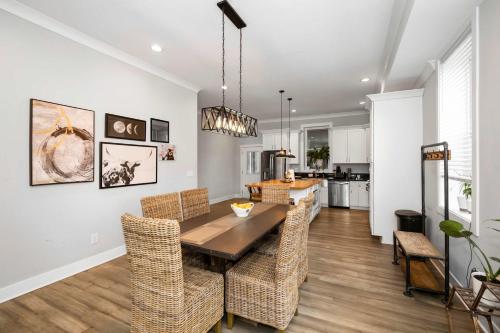 a dining room and kitchen with a table and chairs at Cincy Comfort Retreat in Cincinnati