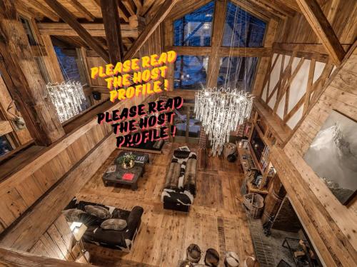 an overhead view of a living room in a log cabin at Luxury Chalet Corvara with Pool & Gym in Colfosco
