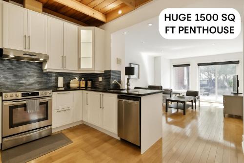 a kitchen with white cabinets and a living room at STUNNING full APARTMENTS - stocked KITCHENS - WASHER & DRYERS - WORKSPACE PROVIDED - FAST WIFI - LOCATED on the FAMOUS ST Denis street - Near METRO MONT ROYAL in Montréal