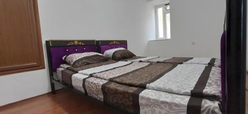 a bedroom with a large bed in a room at Double gates home in Baku