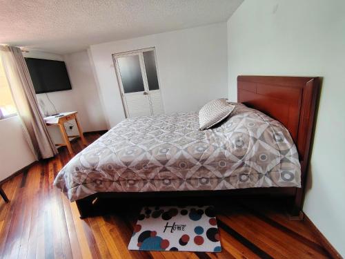 Postel nebo postele na pokoji v ubytování Departamento en zona residencial cerca del centro