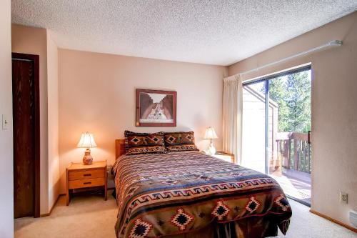 a bedroom with a bed and a large window at Winterpoint 42 by Ski Country Resorts in Breckenridge