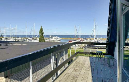 a balcony with a view of a marina with boats at Cozy Home In Haderslev With Wifi in Haderslev