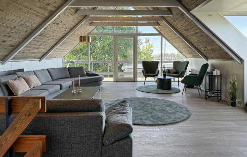 a living room with a couch and some chairs at Cozy Home In Haderslev With Wifi in Haderslev
