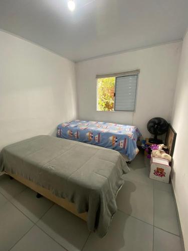 Ένα ή περισσότερα κρεβάτια σε δωμάτιο στο Casa de praia