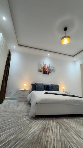 Ένα ή περισσότερα κρεβάτια σε δωμάτιο στο Oumya apartment