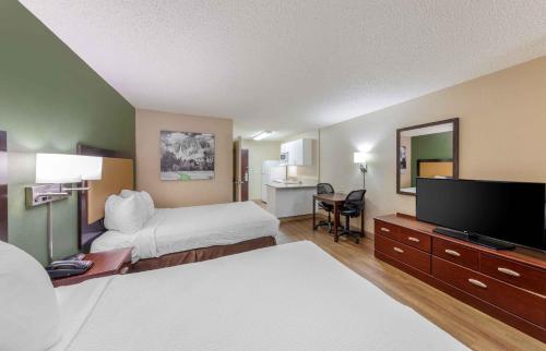 a hotel room with two beds and a flat screen tv at Extended Stay America Suites - Los Angeles - Simi Valley in Santa Susana Knolls