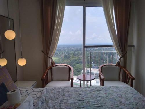 Voodi või voodid majutusasutuse Tagaytay Smdc Wind Residences by Le Grand Liz's Place toas