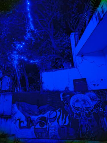 a room with a wall with blue lights at Anand hostel in Pushkar