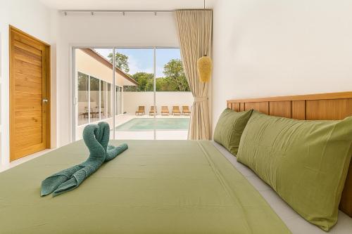 Postel nebo postele na pokoji v ubytování Blue Riviera 4 BR Pool Villa