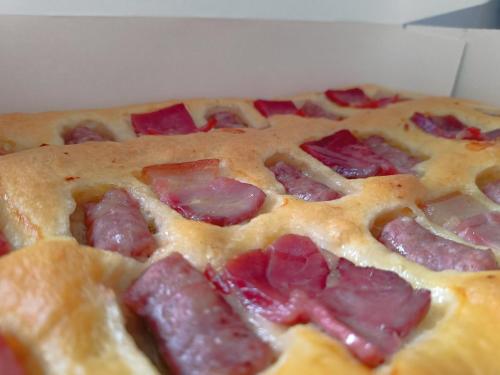 a pepperoni pizza sitting on top of a box at CASA RURAL ALEGRÍA in Caudete de las Fuentes